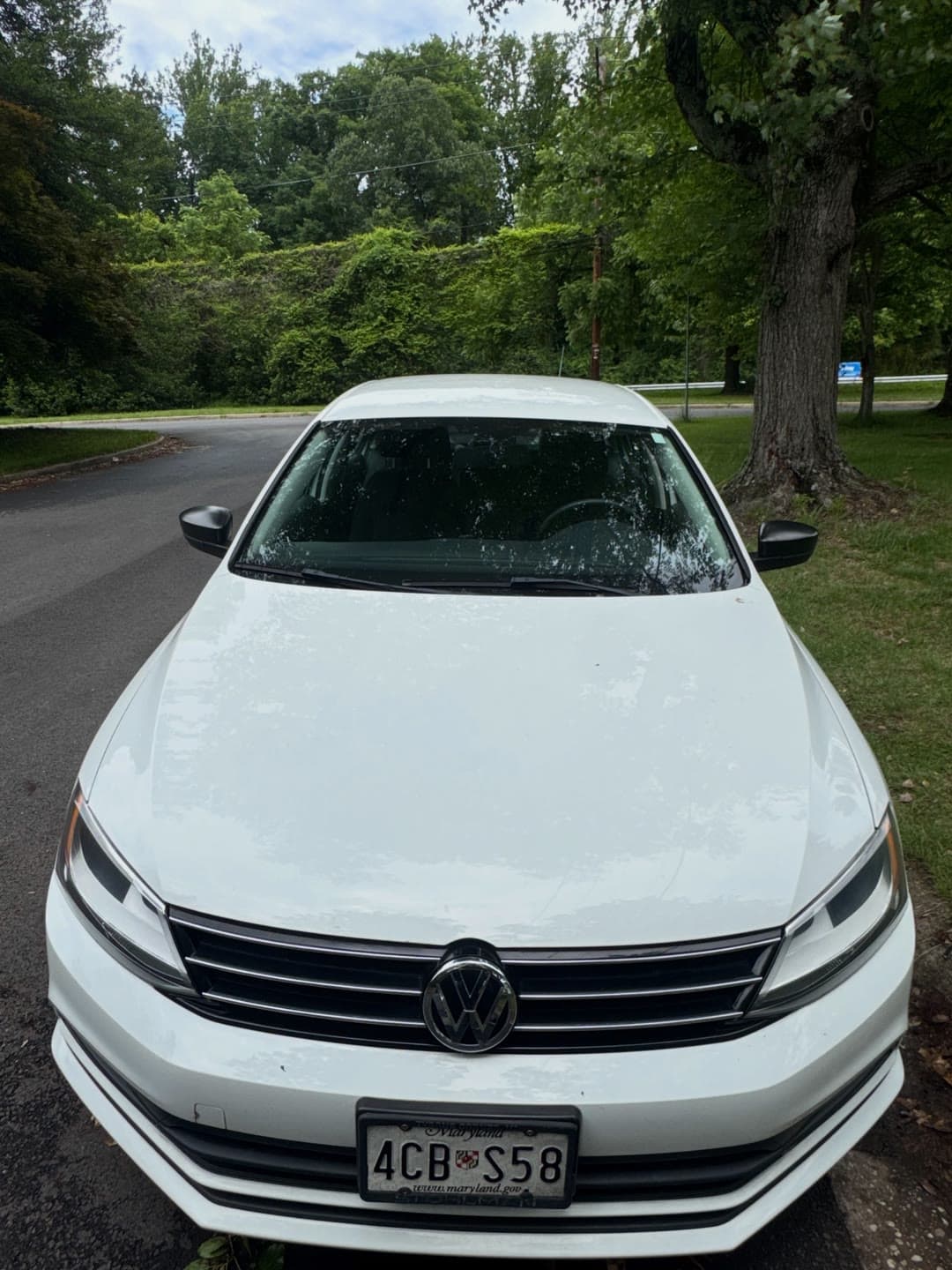 Windshield replacement on a white Volkswagen Jetta, from removal to clean install