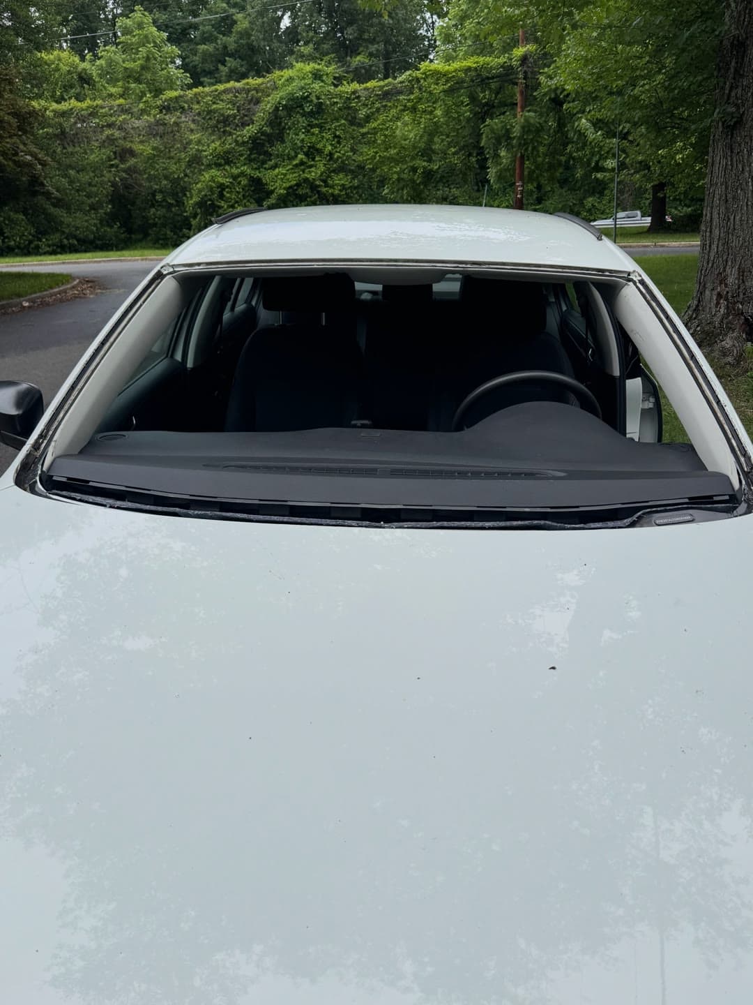 Windshield replacement on a white Volkswagen Jetta, from removal to clean install