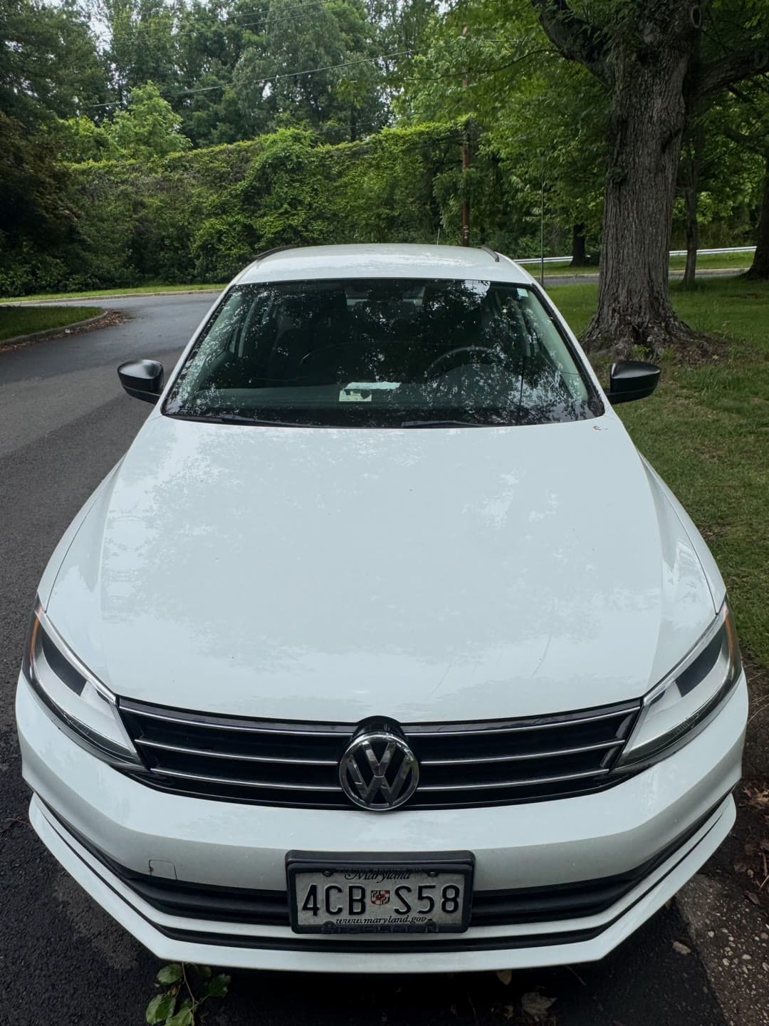Windshield replacement on a white Volkswagen Jetta, from removal to clean install