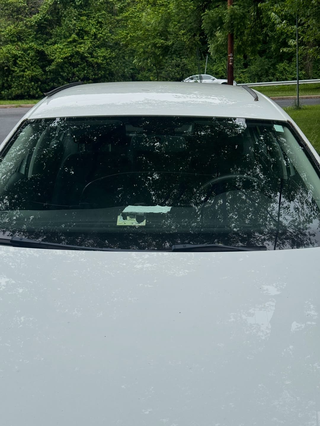 Windshield replacement on a white Volkswagen Jetta, from removal to clean install